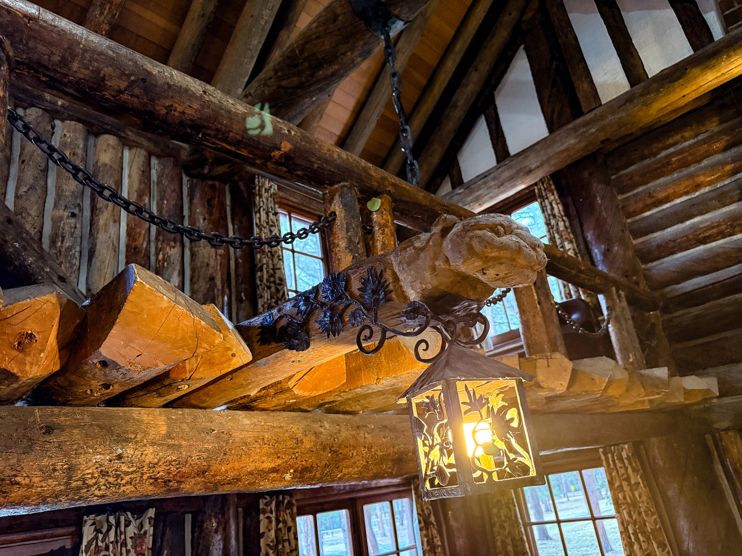 Wooden interior of Ponderosa Lodge at La Foret Conference and Retreat Center, with a hanging lantern and chain.